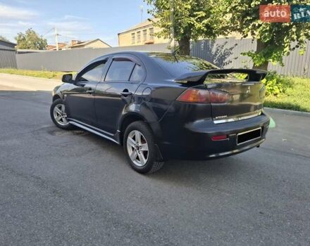 Черный Мицубиси Лансер, объемом двигателя 2 л и пробегом 230 тыс. км за 7000 $, фото 22 на Automoto.ua