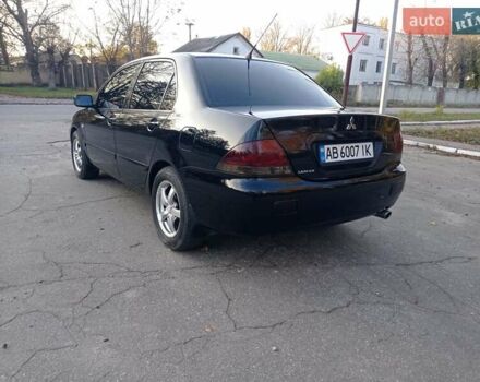 Чорний Міцубісі Lancer, об'ємом двигуна 1.58 л та пробігом 286 тис. км за 4950 $, фото 7 на Automoto.ua