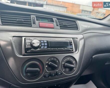 Мицубиси Лансер 2008 в Запорожье на Automoto.ua Черный Мицубиси Лансер, объемом двигателя 1.6 л и пробегом 316 тыс. км за 4290 $, фото 16 на Automoto.ua