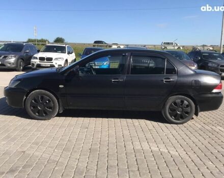 Черный Мицубиси Лансер, объемом двигателя 1.6 л и пробегом 356 тыс. км за 4590 $, фото 14 на Automoto.ua