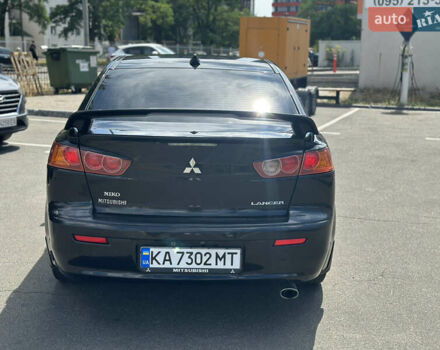 Черный Мицубиси Лансер, объемом двигателя 2 л и пробегом 295 тыс. км за 7000 $, фото 4 на Automoto.ua