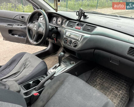 Чорний Міцубісі Lancer, об'ємом двигуна 1.58 л та пробігом 388 тис. км за 2300 $, фото 10 на Automoto.ua