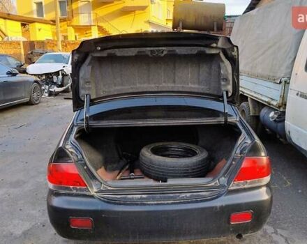 Черный Мицубиси Лансер, объемом двигателя 1.6 л и пробегом 200 тыс. км за 2000 $, фото 11 на Automoto.ua