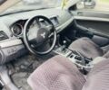 Черный Мицубиси Лансер, объемом двигателя 1.5 л и пробегом 230 тыс. км за 4400 $, фото 1 на Automoto.ua