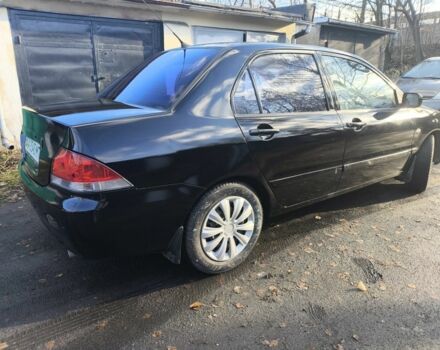 Черный Мицубиси Лансер, объемом двигателя 1.6 л и пробегом 243 тыс. км за 3200 $, фото 5 на Automoto.ua