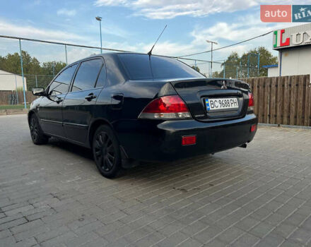 Чорний Міцубісі Lancer, об'ємом двигуна 1.58 л та пробігом 237 тис. км за 4500 $, фото 5 на Automoto.ua