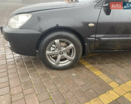 Черный Мицубиси Лансер, объемом двигателя 1.58 л и пробегом 211 тыс. км за 6333 $, фото 26 на Automoto.ua