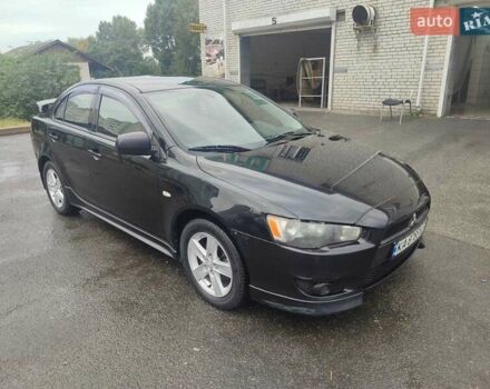 Черный Мицубиси Лансер, объемом двигателя 2 л и пробегом 229 тыс. км за 7300 $, фото 4 на Automoto.ua