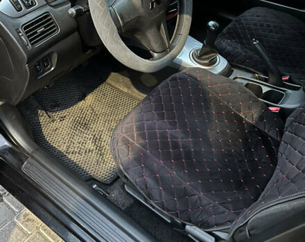 Чорний Міцубісі Lancer, об'ємом двигуна 1.6 л та пробігом 277 тис. км за 3900 $, фото 12 на Automoto.ua