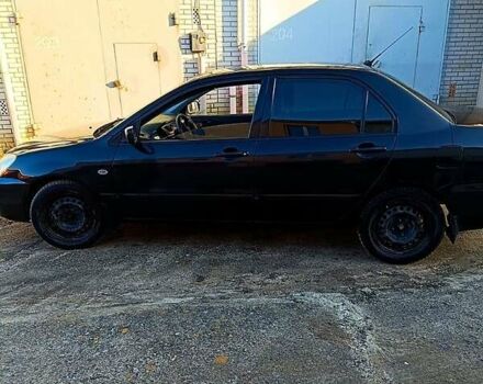 Черный Мицубиси Лансер, объемом двигателя 1.6 л и пробегом 230 тыс. км за 4700 $, фото 3 на Automoto.ua