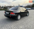 Чорний Міцубісі Lancer, об'ємом двигуна 1.58 л та пробігом 344 тис. км за 3999 $, фото 3 на Automoto.ua