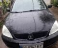 Чорний Міцубісі Lancer, об'ємом двигуна 1.58 л та пробігом 224 тис. км за 4500 $, фото 1 на Automoto.ua