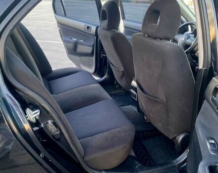 Чорний Міцубісі Lancer, об'ємом двигуна 1.6 л та пробігом 375 тис. км за 4899 $, фото 8 на Automoto.ua