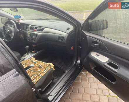 Черный Мицубиси Лансер, объемом двигателя 1.58 л и пробегом 211 тыс. км за 6333 $, фото 38 на Automoto.ua