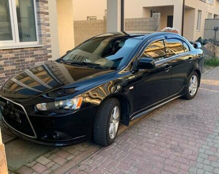 Черный Мицубиси Лансер, объемом двигателя 2 л и пробегом 210 тыс. км за 7000 $, фото 4 на Automoto.ua