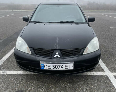Черный Мицубиси Лансер, объемом двигателя 1.58 л и пробегом 214 тыс. км за 4400 $, фото 1 на Automoto.ua