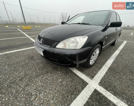 Черный Мицубиси Лансер, объемом двигателя 1.58 л и пробегом 214 тыс. км за 4400 $, фото 13 на Automoto.ua