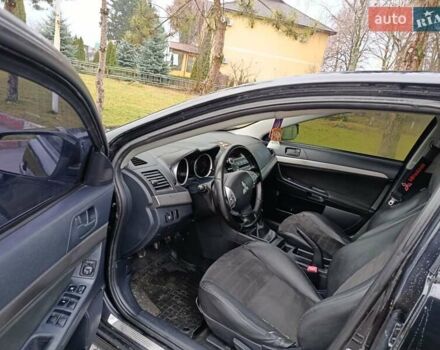 Черный Мицубиси Лансер, объемом двигателя 2 л и пробегом 200 тыс. км за 5100 $, фото 10 на Automoto.ua