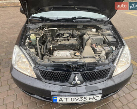 Черный Мицубиси Лансер, объемом двигателя 1.58 л и пробегом 211 тыс. км за 6333 $, фото 24 на Automoto.ua