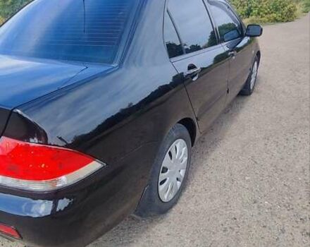 Черный Мицубиси Лансер, объемом двигателя 1.6 л и пробегом 243 тыс. км за 4500 $, фото 5 на Automoto.ua