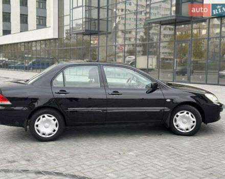 Чорний Міцубісі Lancer, об'ємом двигуна 1.58 л та пробігом 128 тис. км за 5999 $, фото 7 на Automoto.ua