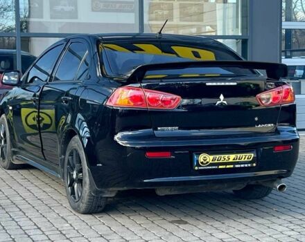 Черный Мицубиси Лансер, объемом двигателя 2 л и пробегом 215 тыс. км за 7000 $, фото 4 на Automoto.ua