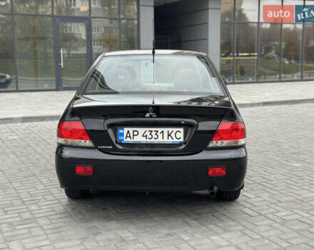 Чорний Міцубісі Lancer, об'ємом двигуна 1.58 л та пробігом 128 тис. км за 5999 $, фото 4 на Automoto.ua