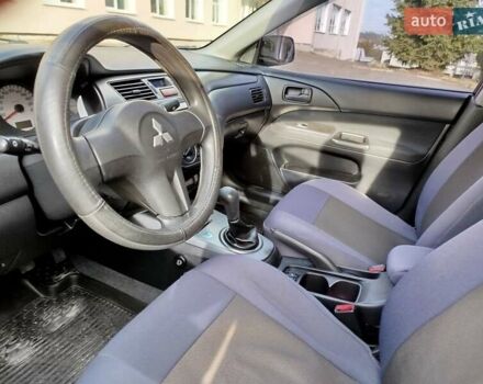 Черный Мицубиси Лансер, объемом двигателя 1.58 л и пробегом 78 тыс. км за 6500 $, фото 26 на Automoto.ua