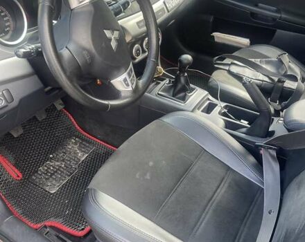 Черный Мицубиси Лансер, объемом двигателя 2 л и пробегом 201 тыс. км за 7000 $, фото 4 на Automoto.ua