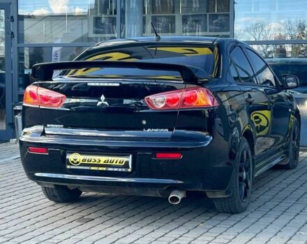 Черный Мицубиси Лансер, объемом двигателя 2 л и пробегом 215 тыс. км за 7000 $, фото 6 на Automoto.ua