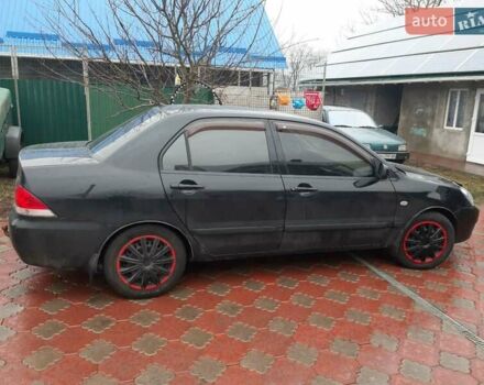 Черный Мицубиси Лансер, объемом двигателя 1.6 л и пробегом 256 тыс. км за 6300 $, фото 2 на Automoto.ua