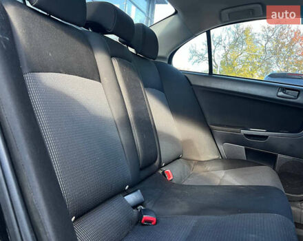 Черный Мицубиси Лансер, объемом двигателя 2 л и пробегом 215 тыс. км за 7000 $, фото 18 на Automoto.ua