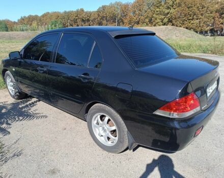 Чорний Міцубісі Lancer, об'ємом двигуна 1.6 л та пробігом 215 тис. км за 5200 $, фото 2 на Automoto.ua