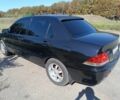 Чорний Міцубісі Lancer, об'ємом двигуна 1.6 л та пробігом 215 тис. км за 5200 $, фото 2 на Automoto.ua