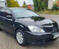 Черный Мицубиси Лансер, объемом двигателя 1.6 л и пробегом 290 тыс. км за 4350 $, фото 3 на Automoto.ua