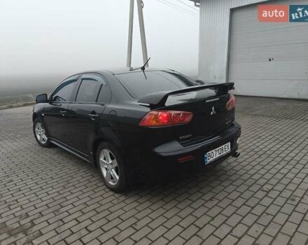 Черный Мицубиси Лансер, объемом двигателя 2 л и пробегом 228 тыс. км за 7000 $, фото 3 на Automoto.ua