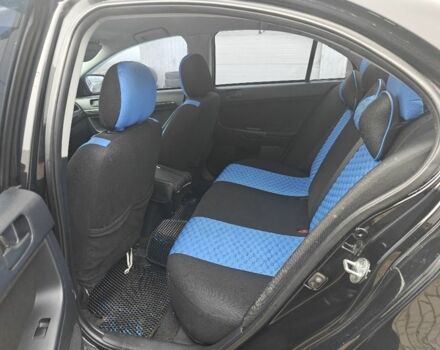 Черный Мицубиси Лансер, объемом двигателя 2 л и пробегом 228 тыс. км за 7000 $, фото 4 на Automoto.ua