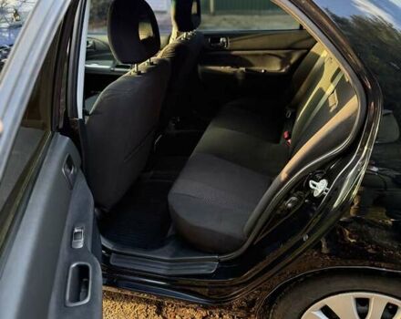 Чорний Міцубісі Lancer, об'ємом двигуна 1.6 л та пробігом 98 тис. км за 5600 $, фото 22 на Automoto.ua