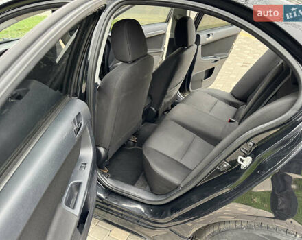 Черный Мицубиси Лансер, объемом двигателя 2 л и пробегом 221 тыс. км за 6750 $, фото 40 на Automoto.ua