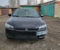 Черный Мицубиси Лансер, объемом двигателя 2.4 л и пробегом 225 тыс. км за 7200 $, фото 1 на Automoto.ua