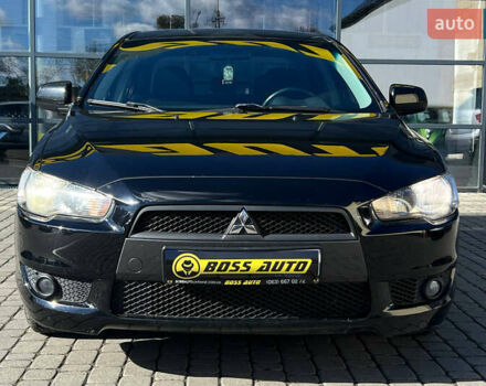 Черный Мицубиси Лансер, объемом двигателя 2 л и пробегом 215 тыс. км за 7000 $, фото 1 на Automoto.ua