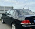 Чорний Міцубісі Lancer, об'ємом двигуна 1.6 л та пробігом 220 тис. км за 3000 $, фото 3 на Automoto.ua