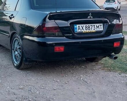 Чорний Міцубісі Lancer, об'ємом двигуна 1.58 л та пробігом 345 тис. км за 4500 $, фото 2 на Automoto.ua