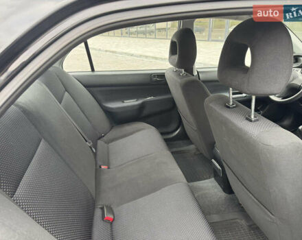 Чорний Міцубісі Lancer, об'ємом двигуна 1.58 л та пробігом 128 тис. км за 5999 $, фото 21 на Automoto.ua