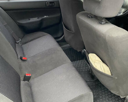 Чорний Міцубісі Lancer, об'ємом двигуна 1.58 л та пробігом 287 тис. км за 4750 $, фото 4 на Automoto.ua
