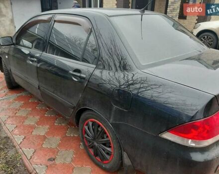 Черный Мицубиси Лансер, объемом двигателя 1.6 л и пробегом 256 тыс. км за 6300 $, фото 3 на Automoto.ua