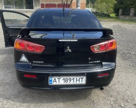 Черный Мицубиси Лансер, объемом двигателя 2 л и пробегом 201 тыс. км за 7000 $, фото 2 на Automoto.ua