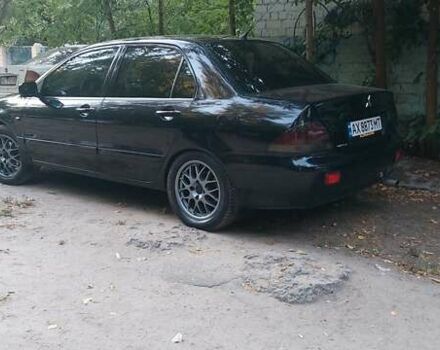 Чорний Міцубісі Lancer, об'ємом двигуна 1.58 л та пробігом 345 тис. км за 4500 $, фото 1 на Automoto.ua