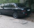 Чорний Міцубісі Lancer, об'ємом двигуна 1.58 л та пробігом 345 тис. км за 4500 $, фото 1 на Automoto.ua