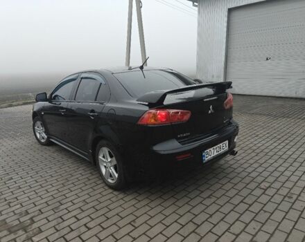 Черный Мицубиси Лансер, объемом двигателя 2 л и пробегом 228 тыс. км за 7000 $, фото 3 на Automoto.ua